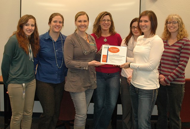 City Workplace Wellness Committee Members receiving plaque
